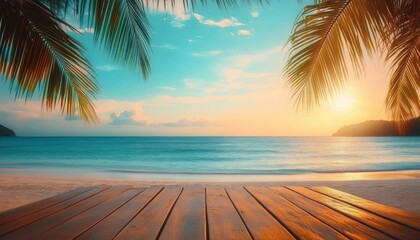 Peaceful tropical beach sunset view framed by palm leaves over calm ocean and wooden deck in foreground