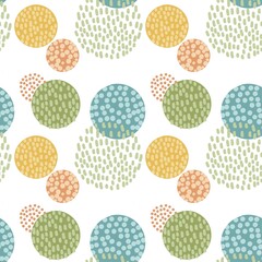 A cheerful abstract pattern featuring colorful dotted circles in shades of blue, green, yellow, and orange on a white background. Perfect for fabric, wrapping paper, or children's decor.
