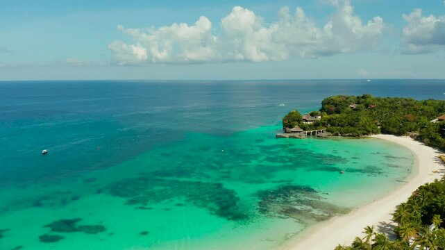 Tropical landscape boats in the turquoise lagoon and tropical beach from above. Seascape with beach on tropical island. Summer and travel vacation concept. Boracay Island, Philippines