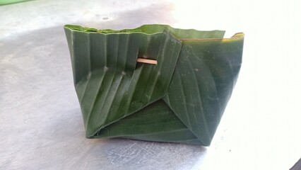 A natural and eco-friendly food wrapper made from banana leaves, commonly used in traditional...