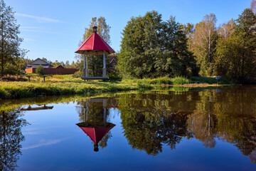 Tranquil Waterfront Gazebo on Sunny Day