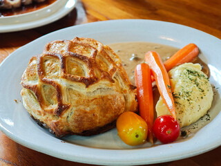 Beef Wellington, classic steak, classic recipe with  salad. 