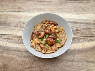 Stir fried rice noodles with Chicken (Kuaitiao khua kai) is a popular Chinese-influenced Thai dish made with stir-fried rice noodles and chicken, top view