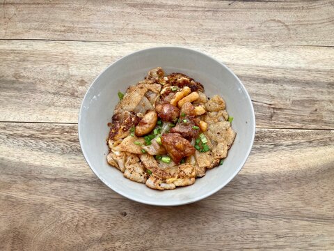 Stir fried rice noodles with Chicken (Kuaitiao khua kai) is a popular Chinese-influenced Thai dish made with stir-fried rice noodles and chicken, top view