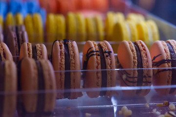 Macarons, close-up, on a shelf.