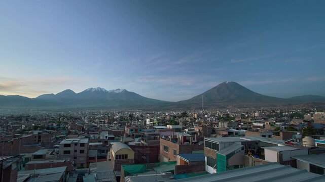 View of the Chachani and Misti volcanoes in the city of Arequipa, from sunset to nightfall.