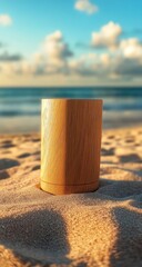 Wooden tumbler on beach at sunrise