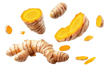 Flying turmeric root and half slices in an isolated display showcasing the vibrant color and texture of this spice