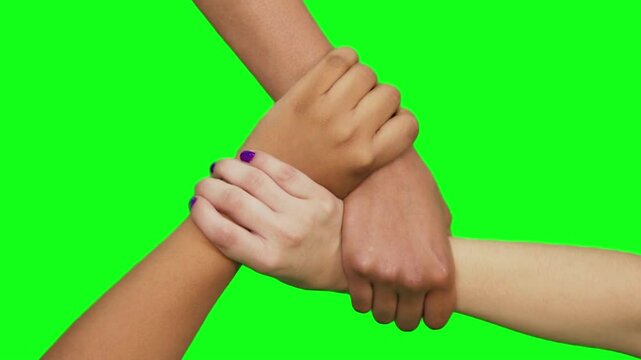 4K Video of Three Hands Holding Together on Solid Green Screen Background - Unity and Teamwork Stock Footage