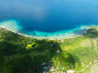 Sandy beach with turquoise sea water in Logbon Island. Romblon, Philippines.