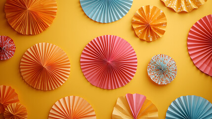 Festive decorative elements including paper fans and fabric patterns on a bright yellow backdrop