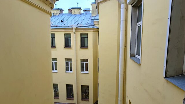 Old architecture of closed courtyards of St. Petersburg. View of the city. Old yard well. 