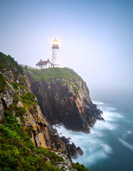 Lonely Lighthouse on a Cliff in Foggy Ocean.cliff, coastline, lighthouse, ocean, rock, white, nature, sky, coast, landscape, calmness, dawn, england, exploration, fog, guidance, horizon, lonely, 
