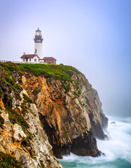 Lonely Lighthouse on a Cliff in Foggy Ocean.cliff, coastline, lighthouse, ocean, rock, white, nature, sky, coast, landscape, calmness, dawn, england, exploration, fog, guidance, horizon, lonely, 
