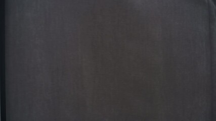 Young woman steps into a dressing area and pulls the curtain shut in a modern fashion boutique.  - Powered by Adobe