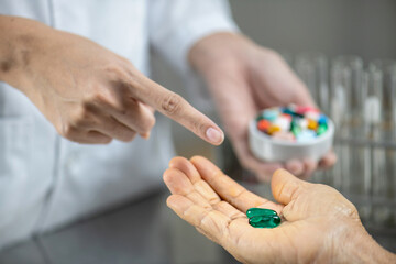 pharmacist explaining medicine dosage to patient