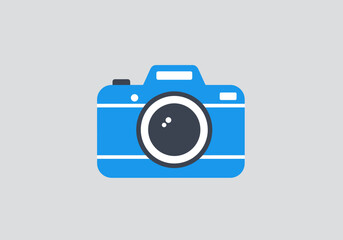 A blue camera icon with a black lens on a gray background