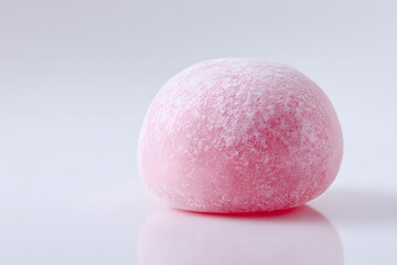 Close-up of Pink Mochi Rice Cake Isolated On White