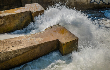 powerful water flowing out spillway dam