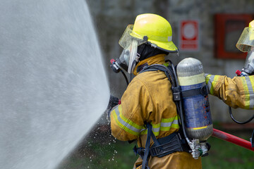 Flames Under Attack as Firefighters Spray Powerful Streams