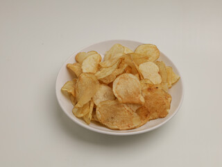 Crunchy snacks or chips on white background
