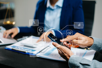 Lawyer using mobile device to review digital contracts with justice icons overlay. Concept of legaltech, consulting, smart law, and innovation