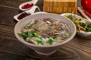 Vietnamese Pho Bo soup with beef and noodles