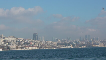 Fototapeta premium Istanbul Skyline Bosphorus View: Panoramic cityscape showcasing historical and modern architecture from the sea.