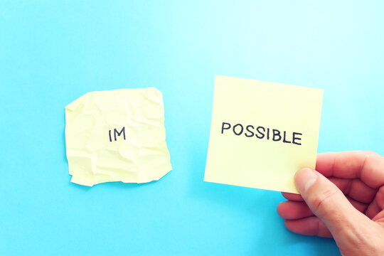 The word impossible is divided into two parts. success and challenge concept.