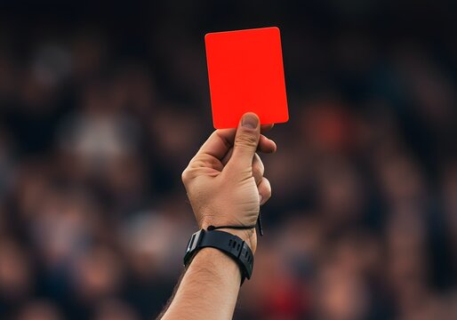 Referee Showing Red Card at a Stadium - Powered by Adobe