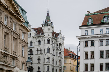White Building with Pointed Tower on Freyung Square in Vienna