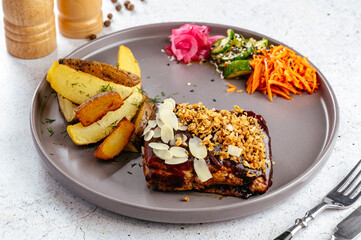 potato wedges. steak and vegetable salad