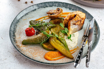 trout steak with grilled vegetables and mushrooms