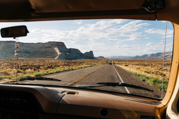 View from car driving Highway 89 through desert in Big Water, Utah.