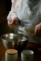 Old woman making dumpling dough from scratch