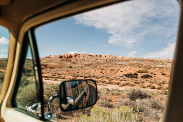 Desert landscape viewed through car window in Arches, Utah