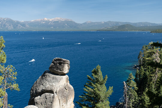 Stone outcrop juts over deep blue Lake Tahoe waters from Rubicon Trail overlook, August 1, 2020