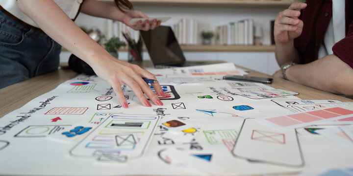 Hands-on UX UI Design Workshop. Participants engaging with design elements.