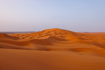 Sunrise panoramic landscape views of Erg Chebbi sand dunes located in Morocco on the western edge of the Sahara Desert