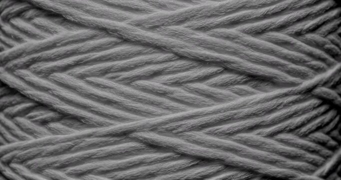 Seamless Woven Texture Background Loop. Texture of Dark rough twine. Video presenting a continuous dark gray woven thread texture, perfect for modern design applications