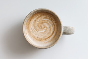 Creamy Coffee with Swirls in a Ceramic Cup on a White Background
