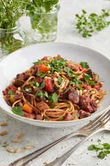 Mediterranean vegetable bolognese on a white plate