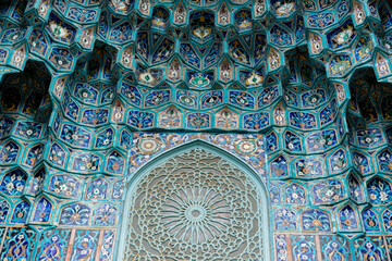 Colorful Geometric Islamic Tilework Decoration with Intricate Patterns and Floral Designs