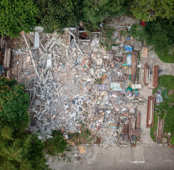 Aerial view of demolition debris on a old house.