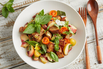 Panzanella with peach, tomato and basil