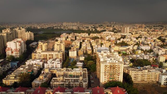 Aerial shot of BTM lake and city skyscrappers in background in Bangalore, Karnataka, India	
