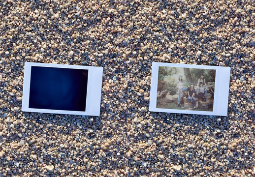 Horizontal Instant Photo Resting on Sandy Ground