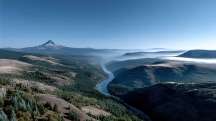Panoramic vista of a snow-capped mountain, a meandering river cutting through a hazy valley, nestled amidst rolling hills and coniferous forests under a clear, bright sky