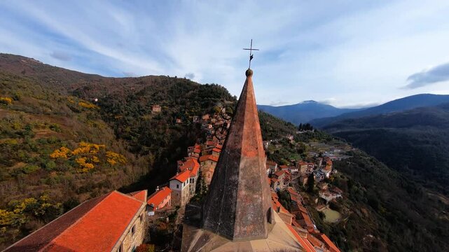 Apricale, italy, showcasing its quaint rooftops and surrounding mountains, aerial view