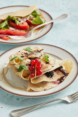 Sweet and savory pancakes on one plate